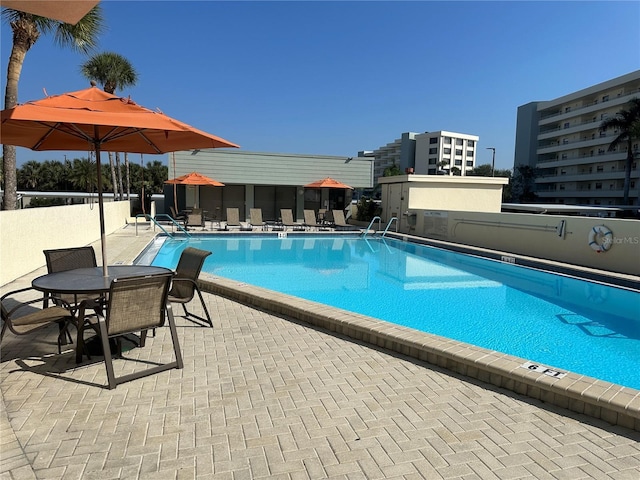 view of swimming pool with a patio area