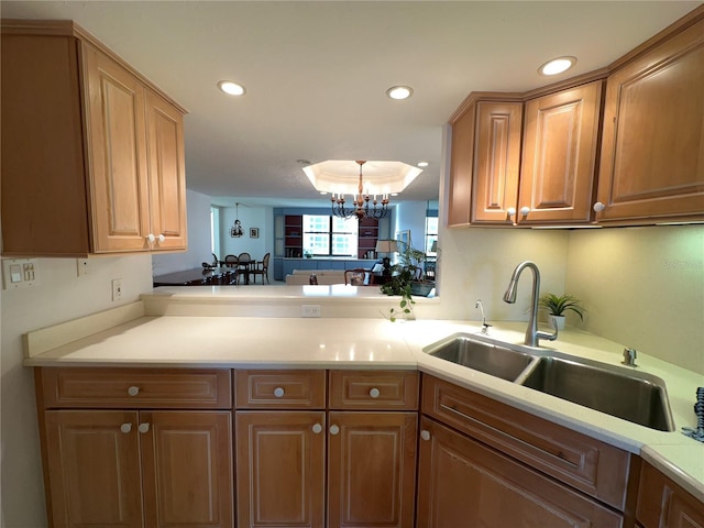 5780 Midnight Pass Rd Unit 303B, Sarasota, FL 34242 - kitchen featuring light countertops, a chandelier, recessed lighting, and brown cabinets