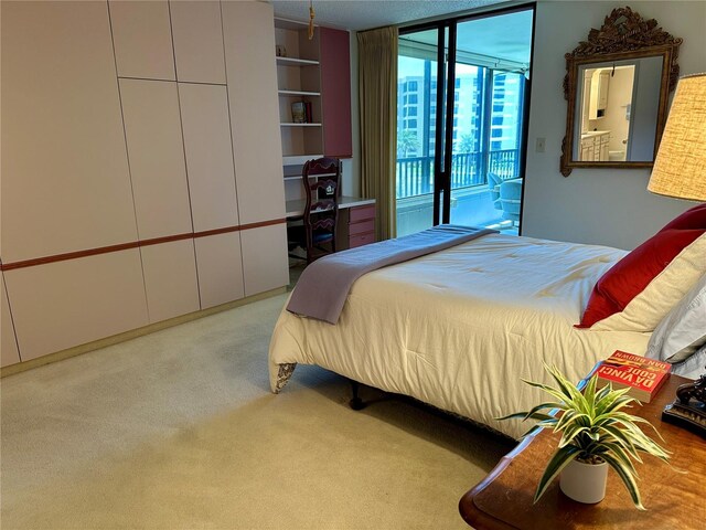 5780 Midnight Pass Rd Unit 303B, Sarasota, FL 34242 - bedroom featuring access to outside and carpet floors