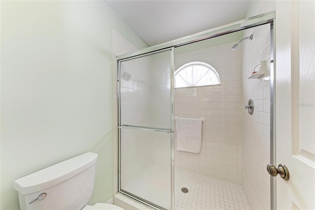 bathroom with toilet and walk in shower