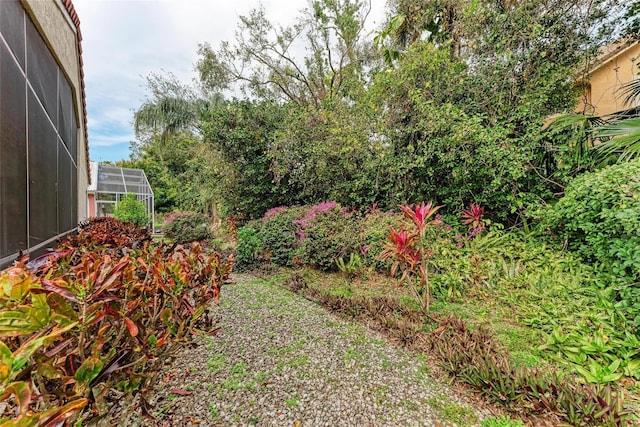 view of yard with a lanai