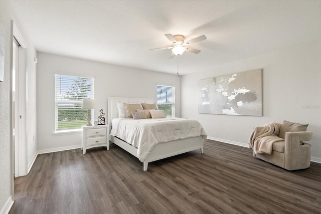 bedroom with ceiling fan and dark hardwood / wood-style floors