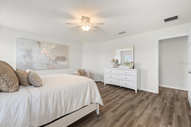 bedroom with dark wood-type flooring and ceiling fan