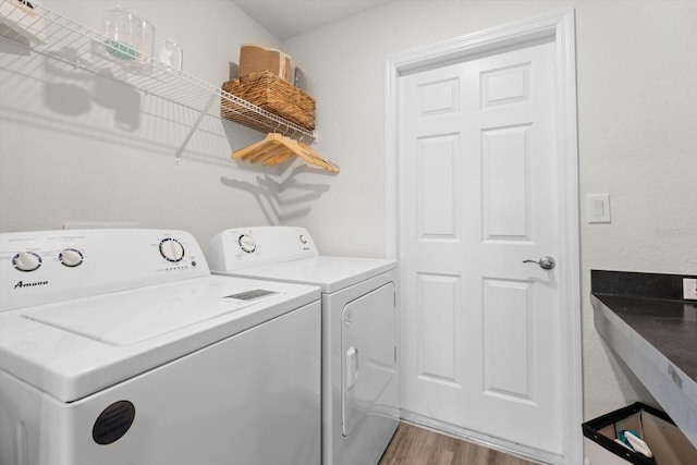 washroom featuring light wood-type flooring and independent washer and dryer