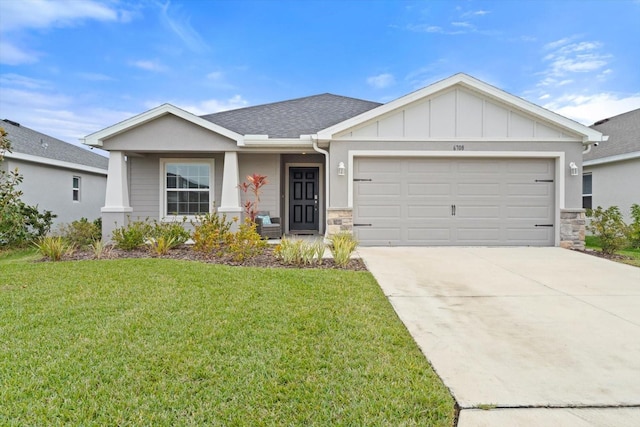 view of front facade featuring a garage and a front yard