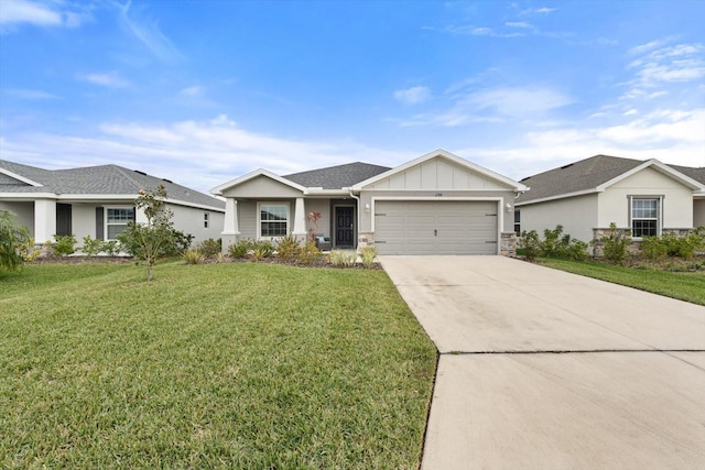 ranch-style house featuring a garage and a front lawn