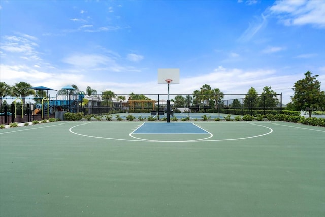 view of sport court featuring a playground