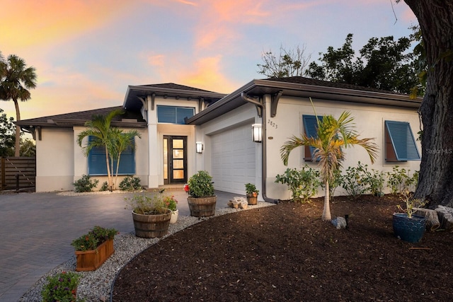 prairie-style home featuring a garage