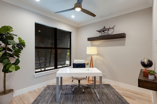 home office featuring ornamental molding, hardwood / wood-style floors, and ceiling fan