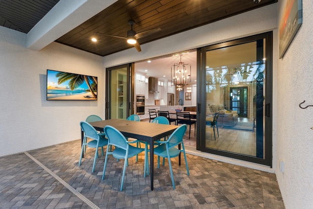 dining space with wood ceiling and a chandelier