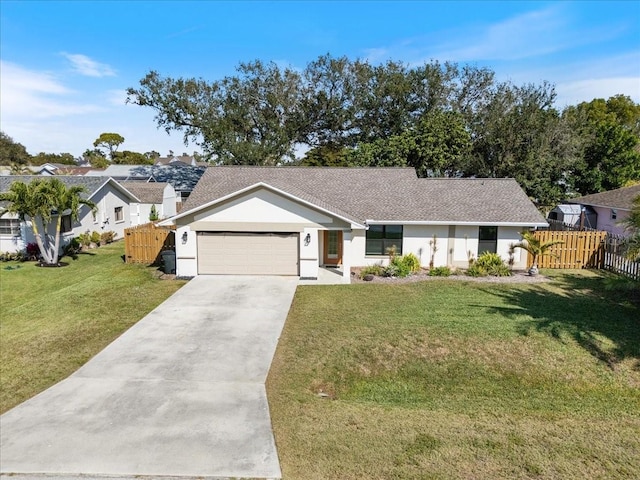 view of front of property with a garage and a front yard