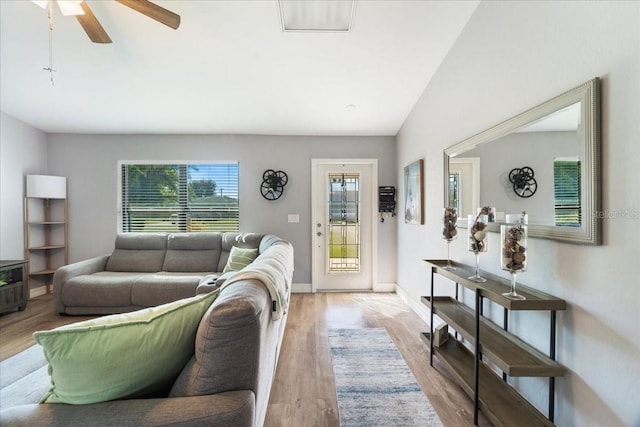 living room with ceiling fan and light wood-type flooring