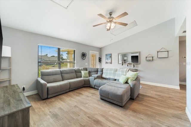 living room with lofted ceiling, light hardwood / wood-style floors, and ceiling fan