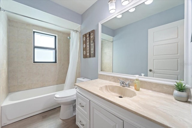 full bathroom featuring wood-type flooring, shower / bath combo, vanity, and toilet