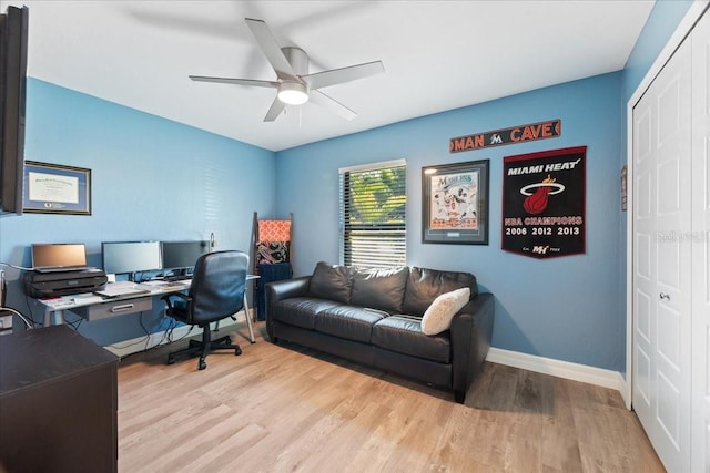 office with ceiling fan and light wood-type flooring