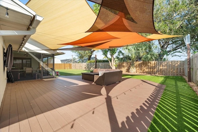 wooden deck with an outdoor living space and a lawn