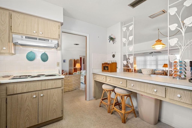 kitchen featuring white electric cooktop and decorative backsplash