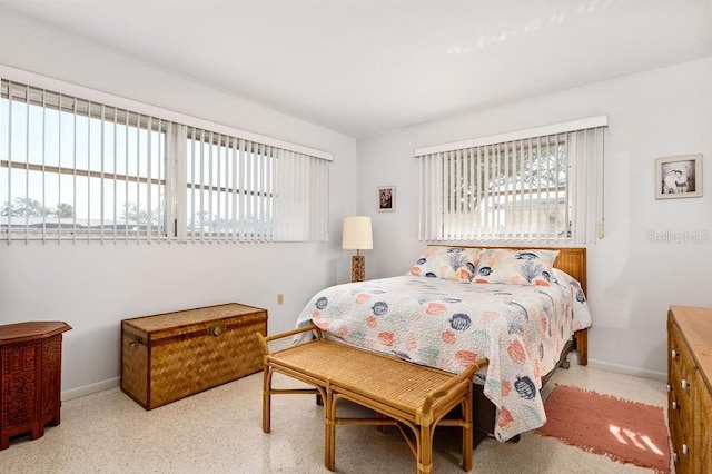 bedroom featuring multiple windows