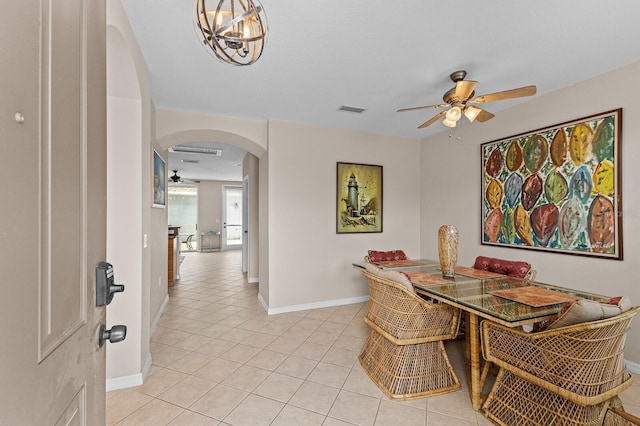 tiled dining space featuring ceiling fan