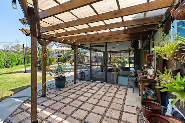 view of patio with a pool and a pergola