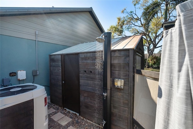 view of outbuilding with central AC unit