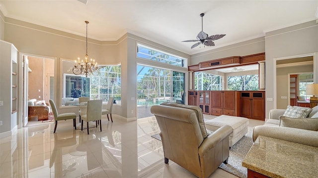 interior space with ceiling fan with notable chandelier and ornamental molding