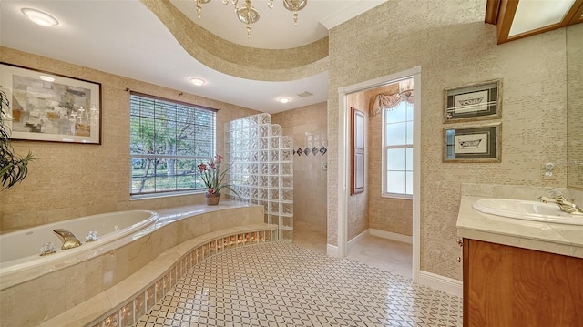 bathroom featuring tile patterned flooring, vanity, plenty of natural light, and plus walk in shower