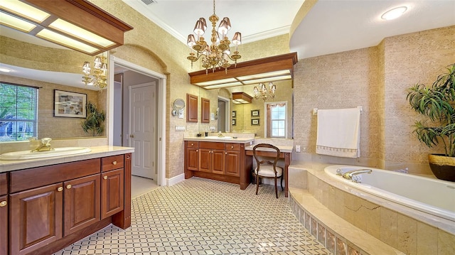 bathroom featuring ornamental molding, a healthy amount of sunlight, vanity, and a chandelier