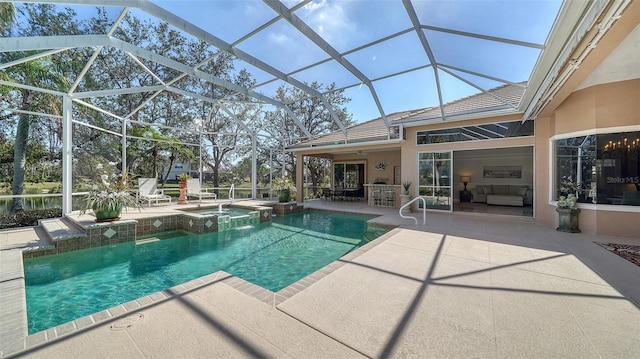 view of pool featuring a bar, a lanai, a patio, and an in ground hot tub