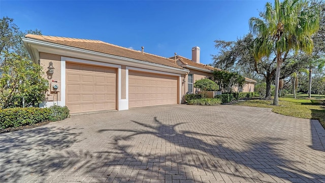 view of front of home with a garage