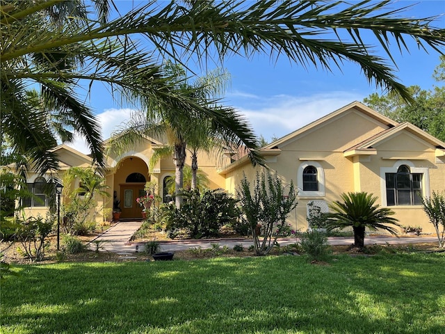15207 17th Ave E, Bradenton, FL 34212 - mediterranean / spanish-style house featuring stucco siding and a front lawn