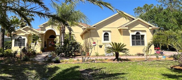 15207 17th Ave E, Bradenton, FL 34212 - view of front facade featuring stucco siding and a front yard