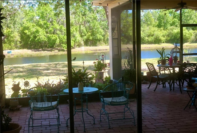 15207 17th Ave E, Bradenton, FL 34212 - sunroom featuring a water view, a ceiling fan, and healthy amount of natural light