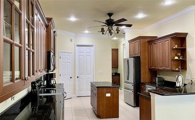15207 17th Ave E, Bradenton, FL 34212 - kitchen with stainless steel appliances, a center island, ceiling fan, light tile patterned flooring, and open shelves
