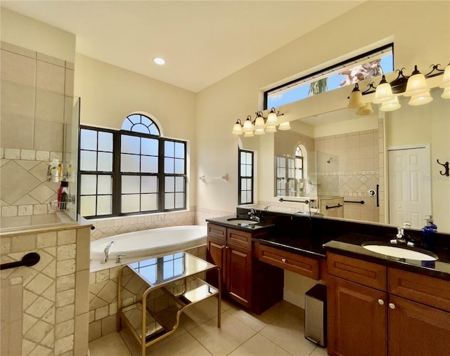 15207 17th Ave E, Bradenton, FL 34212 - bathroom with double vanity, a garden tub, tile patterned floors, and walk in shower