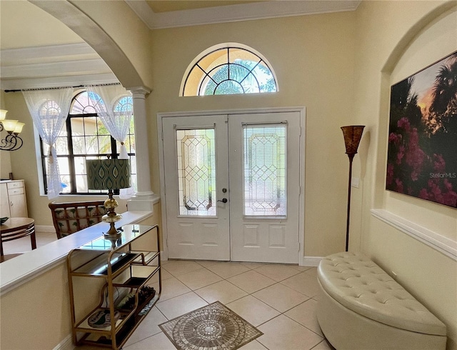 15207 17th Ave E, Bradenton, FL 34212 - foyer with arched walkways, healthy amount of natural light, light tile patterned floors, and ornamental molding