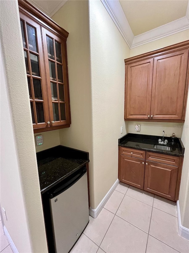 15207 17th Ave E, Bradenton, FL 34212 - indoor bar featuring crown molding, light tile patterned flooring, and refrigerator