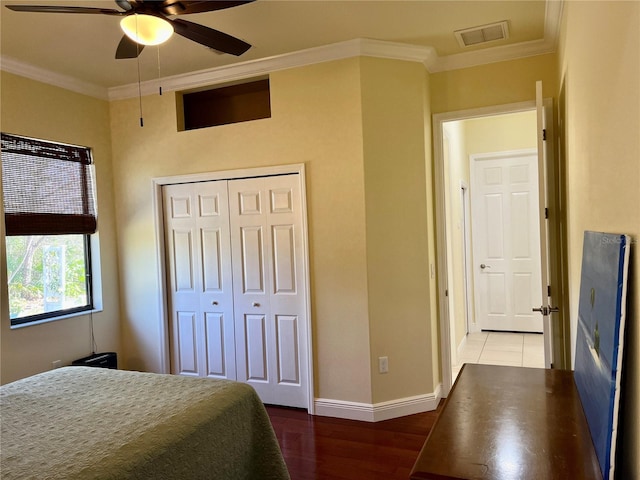15207 17th Ave E, Bradenton, FL 34212 - bedroom featuring ornamental molding, wood finished floors, a closet, and a ceiling fan