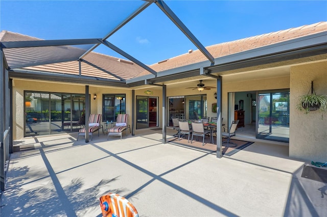 back of house featuring a lanai, a patio area, and ceiling fan