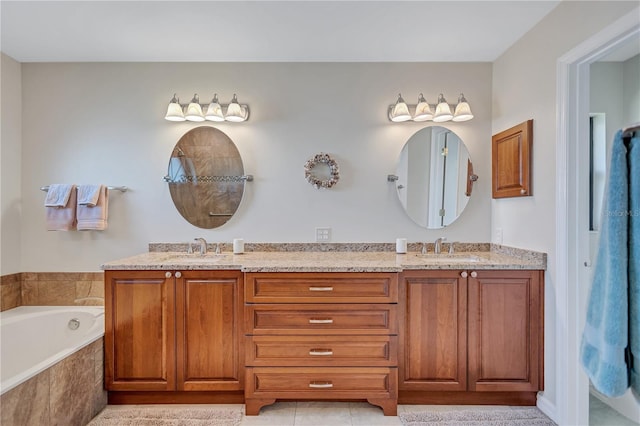 bathroom featuring vanity and tiled tub