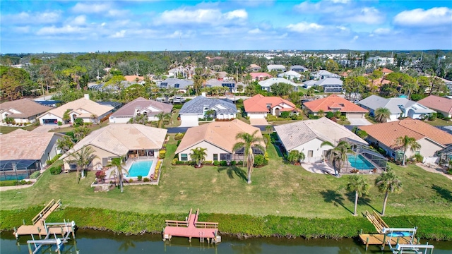 birds eye view of property featuring a water view