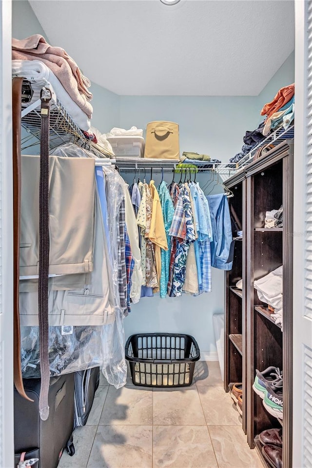 104 Inlets Blvd Unit 104, Nokomis, FL 34275 - walk in closet featuring tile patterned flooring