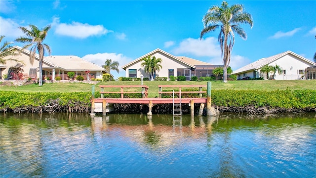 104 Inlets Blvd Unit 104, Nokomis, FL 34275 - dock featuring a water view and a yard