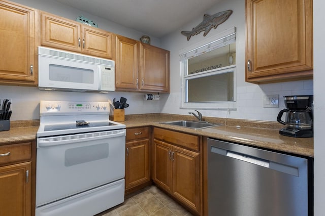 kitchen with white appliances, light tile patterned floors, sink, and backsplash