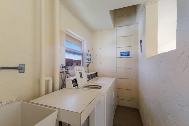 laundry room featuring sink and washing machine and clothes dryer