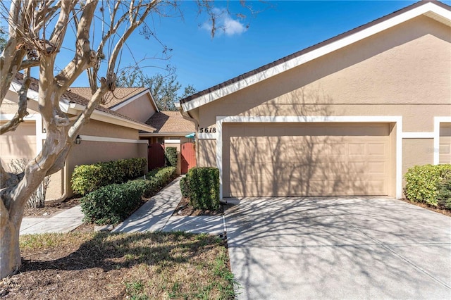 view of side of property with a garage