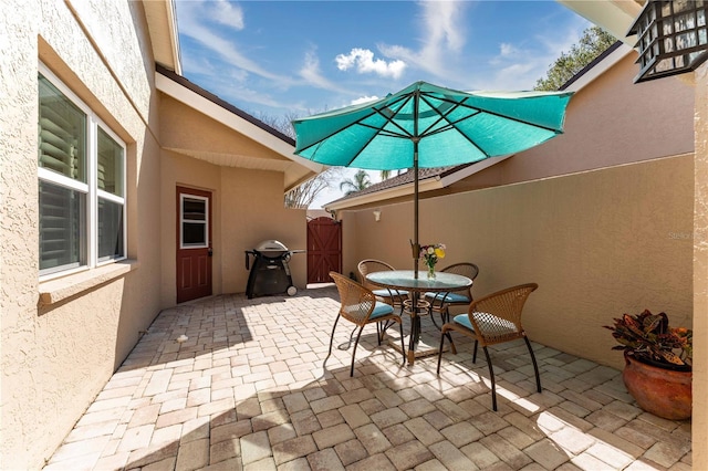 view of patio featuring a grill