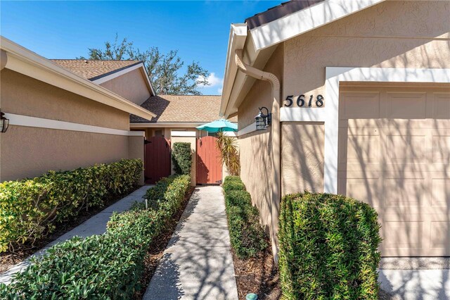 5618 Monte Rosso Rd, Sarasota, FL 34243 - doorway to property with a garage