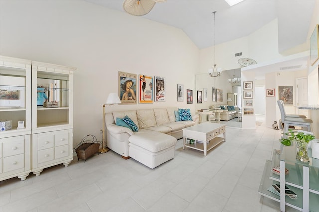 5618 Monte Rosso Rd, Sarasota, FL 34243 - living room featuring a chandelier and high vaulted ceiling