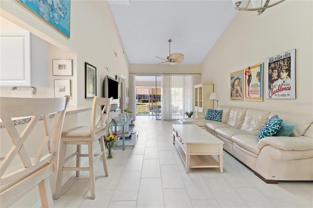 5618 Monte Rosso Rd, Sarasota, FL 34243 - living room featuring ceiling fan, light tile patterned floors, and high vaulted ceiling